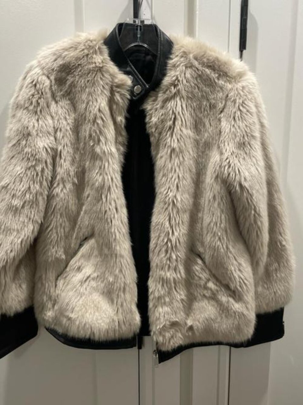 Faux fur jacket with black collar and buttons